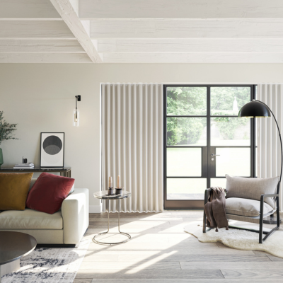 Cream wave curtains over large glass doors